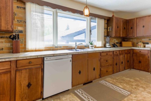 1444 Acadia Drive Se, Calgary, AB - Indoor Photo Showing Kitchen With Double Sink