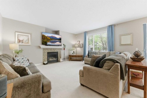 143 Chaparral Ravine View Se, Calgary, AB - Indoor Photo Showing Living Room With Fireplace