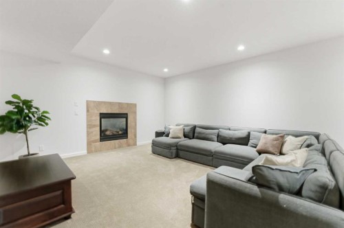 335 Chapala Point Se, Calgary, AB - Indoor Photo Showing Living Room With Fireplace