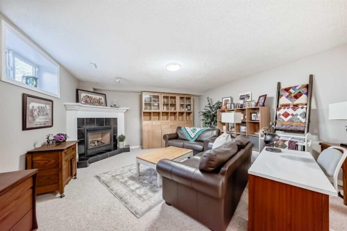 39 Westfall Crescent, Okotoks, AB - Indoor Photo Showing Living Room With Fireplace