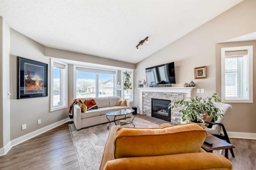 39 Westfall Crescent, Okotoks, AB - Indoor Photo Showing Living Room With Fireplace