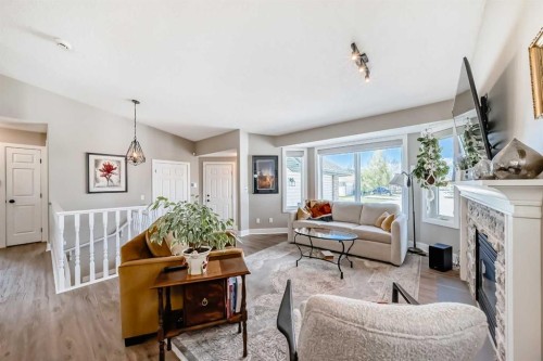 39 Westfall Crescent, Okotoks, AB - Indoor Photo Showing Living Room With Fireplace