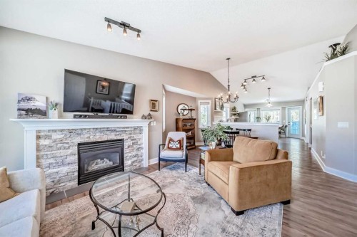 39 Westfall Crescent, Okotoks, AB - Indoor Photo Showing Living Room With Fireplace