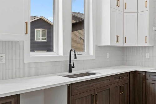 101 Creekstone Hill Sw, Calgary, AB - Indoor Photo Showing Kitchen With Double Sink With Upgraded Kitchen