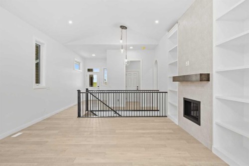 101 Creekstone Hill Sw, Calgary, AB - Indoor Photo Showing Other Room With Fireplace
