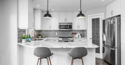 724 Luxstone Landing Sw, Airdrie, AB - Indoor Photo Showing Kitchen With Upgraded Kitchen