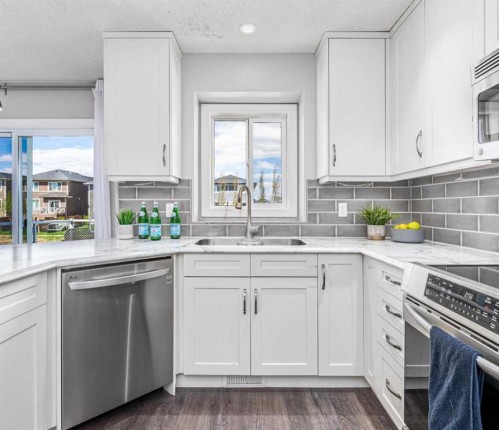 724 Luxstone Landing Sw, Airdrie, AB - Indoor Photo Showing Kitchen With Upgraded Kitchen