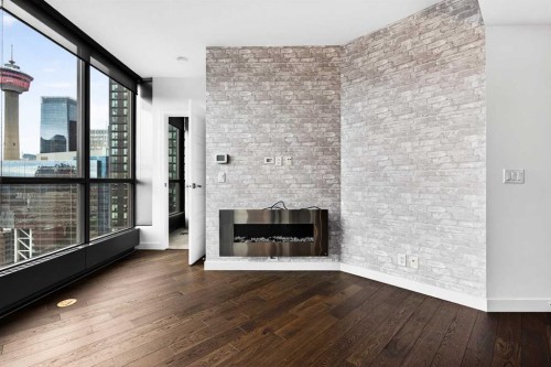 2010-225 11 Avenue Se, Calgary, AB - Indoor Photo Showing Other Room With Fireplace