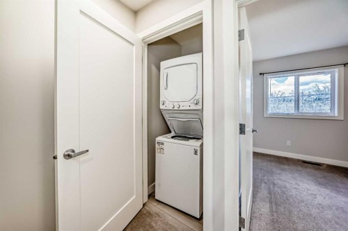 102 Tuscany Summit Square Nw, Calgary, AB - Indoor Photo Showing Laundry Room