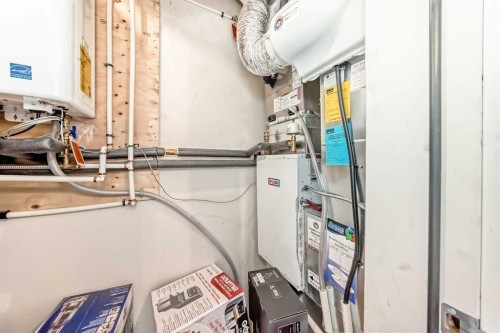 102 Tuscany Summit Square Nw, Calgary, AB - Indoor Photo Showing Laundry Room