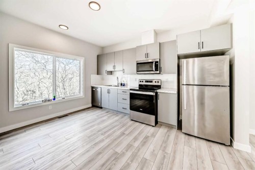 102 Tuscany Summit Square Nw, Calgary, AB - Indoor Photo Showing Kitchen With Stainless Steel Kitchen