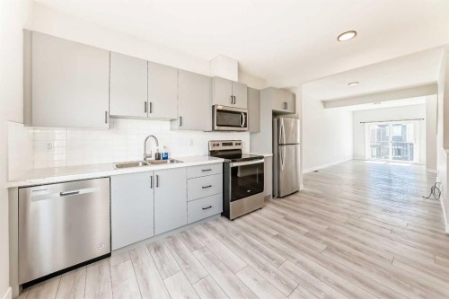 102 Tuscany Summit Square Nw, Calgary, AB - Indoor Photo Showing Kitchen With Stainless Steel Kitchen