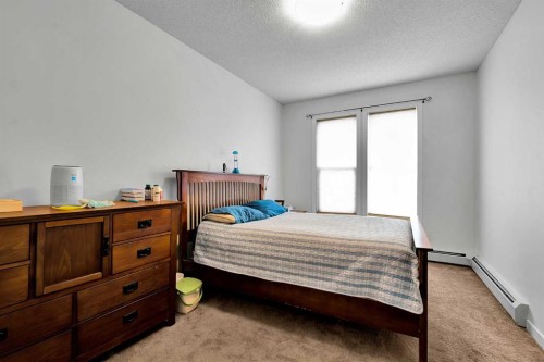 224-207 Sunset Drive, Cochrane, AB - Indoor Photo Showing Bedroom