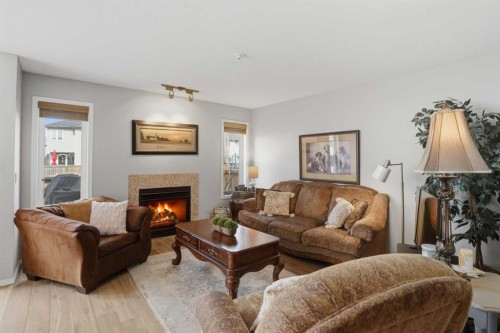 87 Bridlecrest Road Sw, Calgary, AB - Indoor Photo Showing Living Room With Fireplace