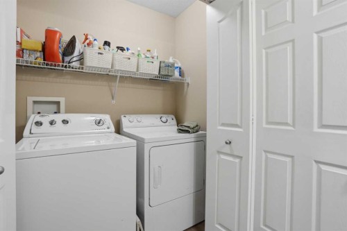 87 Bridlecrest Road Sw, Calgary, AB - Indoor Photo Showing Laundry Room