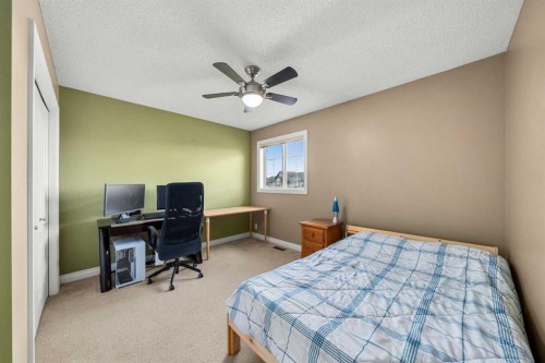 117 Westmount Road, Okotoks, AB - Indoor Photo Showing Bedroom