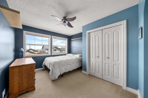 117 Westmount Road, Okotoks, AB - Indoor Photo Showing Bedroom