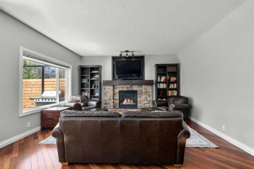 117 Westmount Road, Okotoks, AB - Indoor Photo Showing Living Room With Fireplace