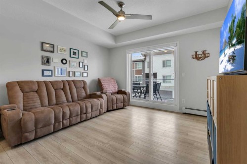 206-370 Harvest Hills Common Ne, Calgary, AB - Indoor Photo Showing Living Room