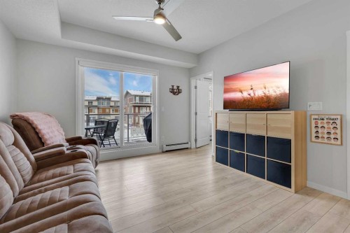 206-370 Harvest Hills Common Ne, Calgary, AB - Indoor Photo Showing Living Room