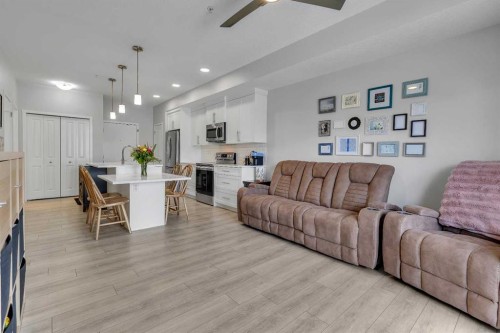 206-370 Harvest Hills Common Ne, Calgary, AB - Indoor Photo Showing Living Room