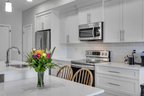 206-370 Harvest Hills Common Ne, Calgary, AB - Indoor Photo Showing Kitchen With Stainless Steel Kitchen With Double Sink With Upgraded Kitchen