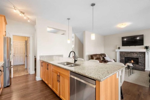 134 Masters Point Se, Calgary, AB - Indoor Photo Showing Kitchen With Fireplace With Double Sink With Upgraded Kitchen