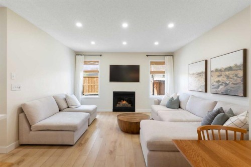 89 Tuscany Springs Heights Nw, Calgary, AB - Indoor Photo Showing Living Room With Fireplace