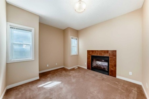 22 Everhollow Rise Sw, Calgary, AB - Indoor Photo Showing Living Room With Fireplace