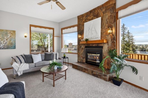 59 Fairview Drive Se, Calgary, AB - Indoor Photo Showing Living Room With Fireplace
