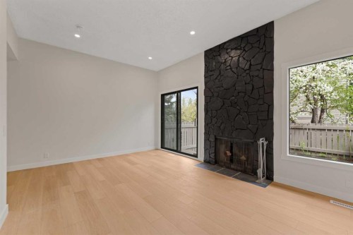 32-99 Midpark Gardens Se, Calgary, AB - Indoor Photo Showing Other Room With Fireplace