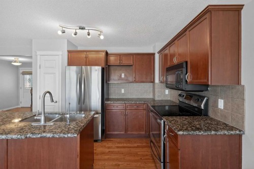 124 Everglen Way Sw, Calgary, AB - Indoor Photo Showing Kitchen With Double Sink With Upgraded Kitchen