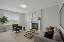 124 Everglen Way Sw, Calgary, AB  - Indoor Photo Showing Living Room With Fireplace 