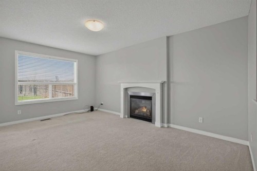124 Everglen Way Sw, Calgary, AB - Indoor With Fireplace