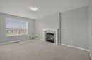124 Everglen Way Sw, Calgary, AB  - Indoor With Fireplace 