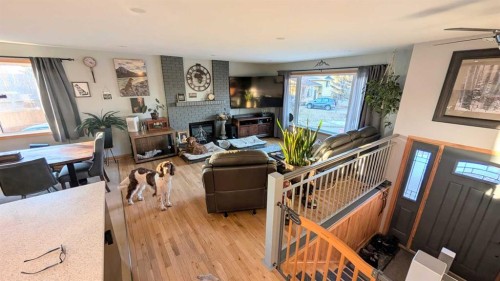 108 Glendale Place, Cochrane, AB - Indoor Photo Showing Living Room With Fireplace