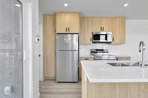 4903 Bowness Road Nw, Calgary, AB - Indoor Photo Showing Kitchen With Stainless Steel Kitchen With Double Sink