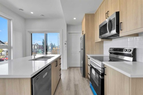 4903 Bowness Road Nw, Calgary, AB - Indoor Photo Showing Kitchen With Stainless Steel Kitchen With Double Sink With Upgraded Kitchen