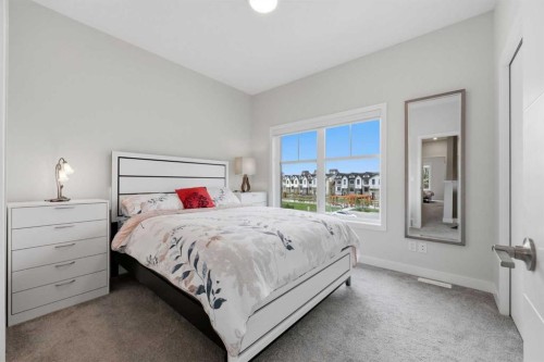 11 Les Jardins Park Se, Calgary, AB - Indoor Photo Showing Bedroom