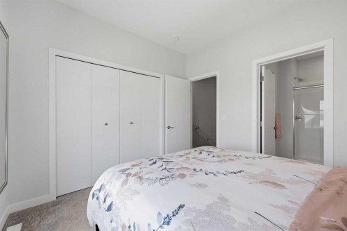11 Les Jardins Park Se, Calgary, AB - Indoor Photo Showing Bedroom