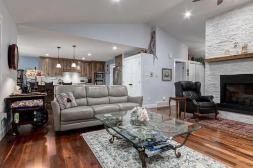 17 Westlynn Drive, Claresholm, AB - Indoor Photo Showing Living Room With Fireplace
