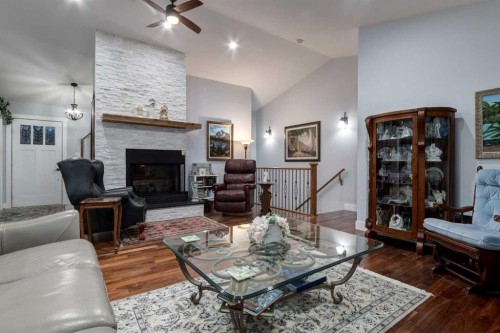 17 Westlynn Drive, Claresholm, AB - Indoor Photo Showing Living Room With Fireplace