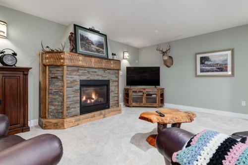 17 Westlynn Drive, Claresholm, AB - Indoor Photo Showing Living Room With Fireplace