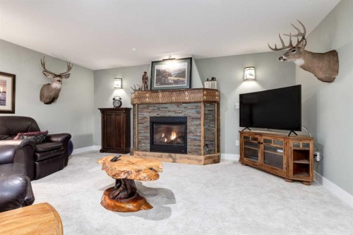 17 Westlynn Drive, Claresholm, AB - Indoor Photo Showing Living Room With Fireplace