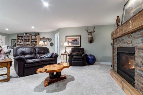 17 Westlynn Drive, Claresholm, AB - Indoor Photo Showing Living Room With Fireplace