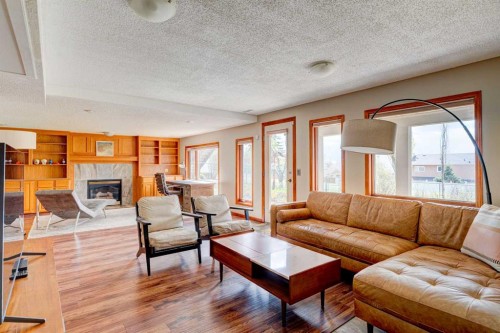 210 Hawkville Close Nw, Calgary, AB - Indoor Photo Showing Living Room With Fireplace
