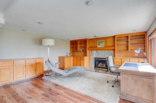 210 Hawkville Close Nw, Calgary, AB - Indoor With Fireplace