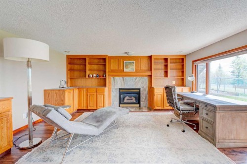 210 Hawkville Close Nw, Calgary, AB - Indoor With Fireplace