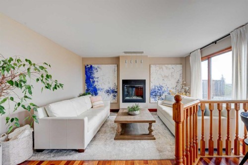 210 Hawkville Close Nw, Calgary, AB - Indoor Photo Showing Living Room With Fireplace
