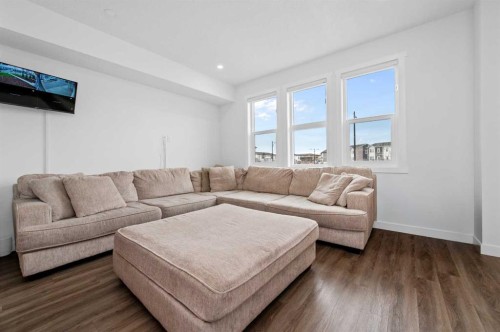 203-33 Merganser Drive, Chestermere, AB - Indoor Photo Showing Living Room